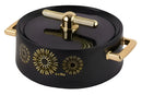 Black and gold kitchen lid with decorative patterns on a white background