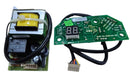 Electrical components including a transformer and a green circuit board with digital display on a white background