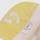 Close-up of a yellow and white patterned leg guard with a visible KST brand label on the side.