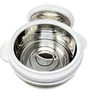 Stainless steel pot with white exterior on a light gray background