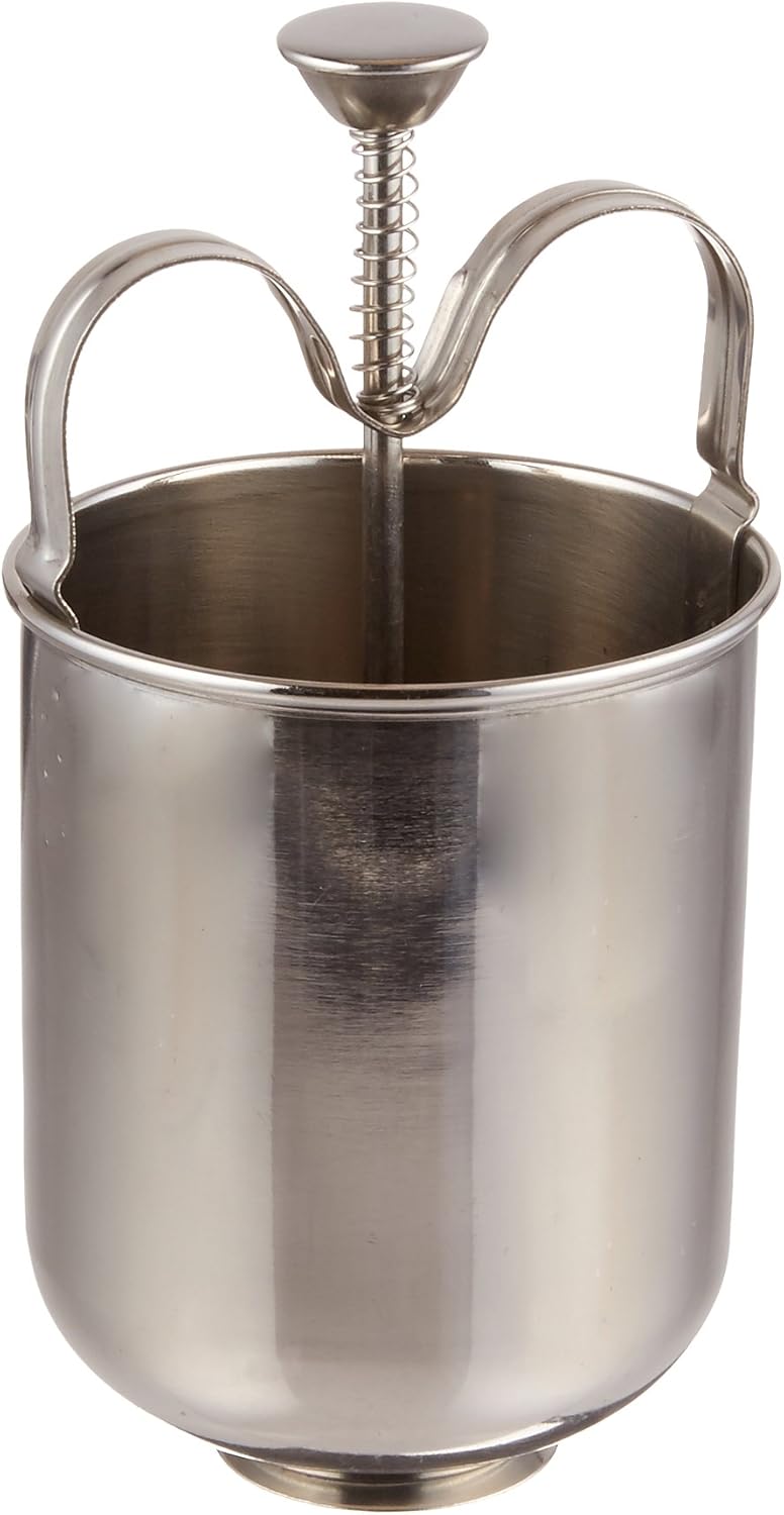 Metallic milk frother with a handle on a white background