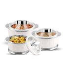 Set of three white ceramic food containers with silver lids on a white background