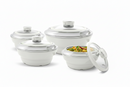 Set of white cookware with lids on a white background