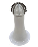 White kitchen tool with metal top on a gray surface