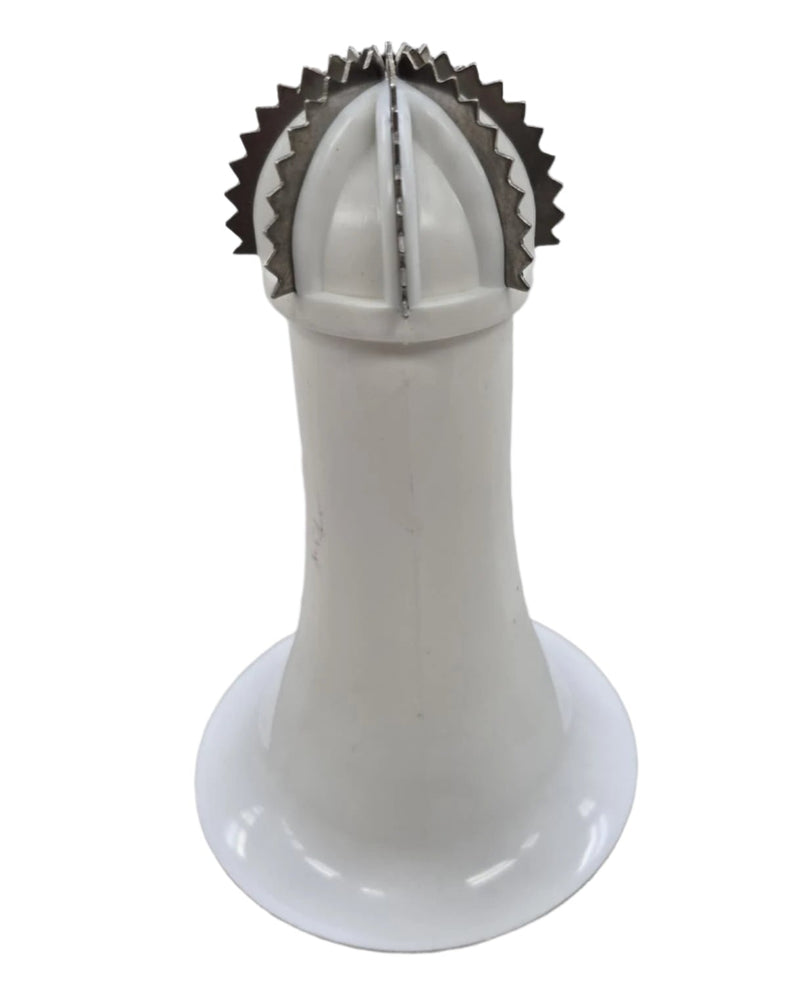 White kitchen tool with metal top on a gray surface