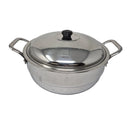 Stainless steel pot with lid on a light gray background