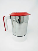 A white and silver food mixer with a clear jar and a red handle.