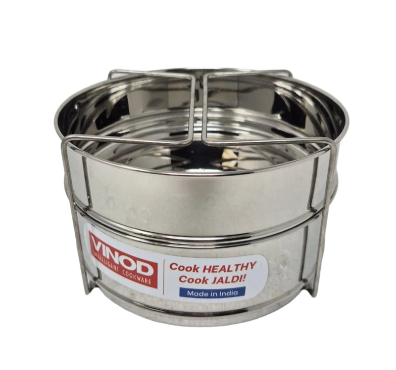 Stainless steel cookware set with 'Vinod' label on a light gray background