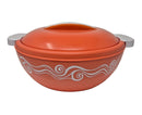 Orange ceramic dish with white decorative patterns on a light gray background