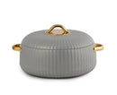 Gray cookware with gold handles on a white background