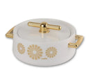 White ceramic pot with gold floral designs and handles on a white background
