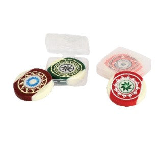 A set of circular carrom board strikers with different designs and colors, displayed in a plastic box.
