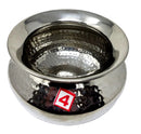 Stainless steel bowl with textured interior on a white background