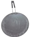 A black concave iron tawa with a handle.