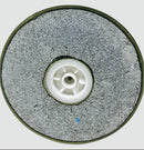 Round grinding wheel with a white center on a light gray background