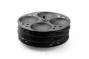A black non-stick idli stand with four racks, made of stainless steel, designed for making idlis.