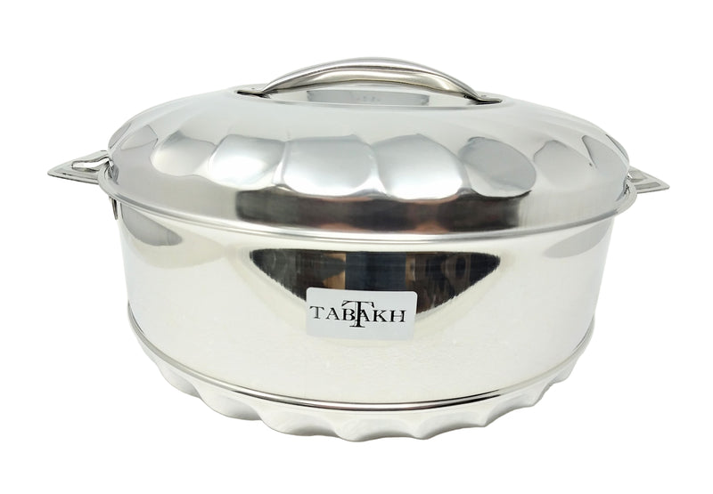 Stainless steel pot with lid on a white background