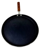 A black non-stick pizza pan with a wooden handle and a metallic rim.